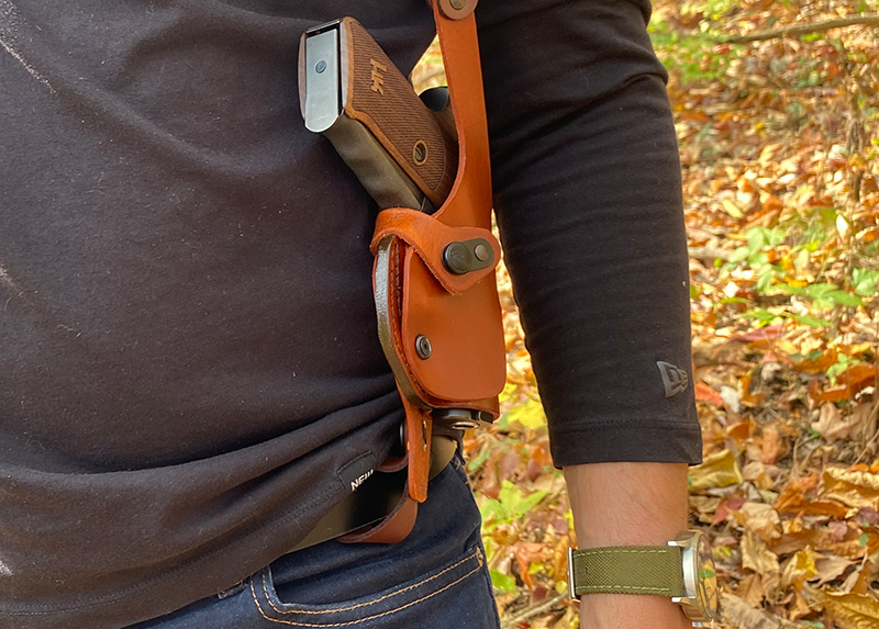 Craft Holsters leather vertical shoulder holster (roto) worn in the open, close-up. 